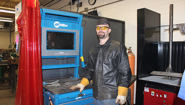 Man working with manufacturing equipment