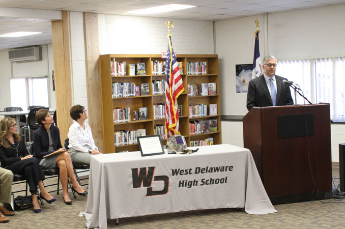 Henderson employee speaking at West Delaware High School