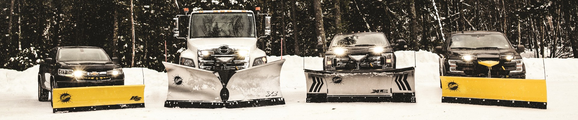 Four trucks with Fisher plows