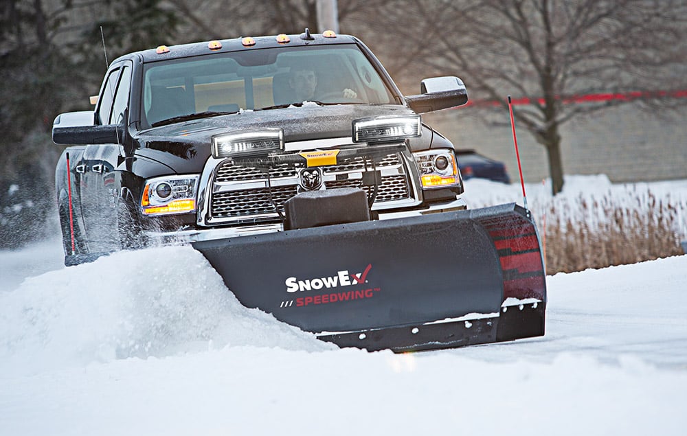 Truck pushing snow with a SnowEx plow