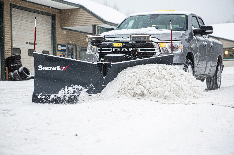 Truck pushing snow with SnowEx plow
