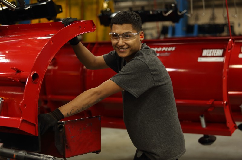 Man working on Western plow