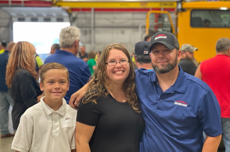 Henderson employee with his family