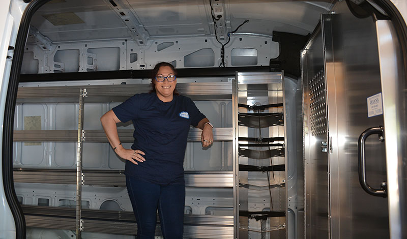 Woman inside of the bed of a van