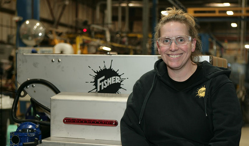 Woman in front of a Fisher product