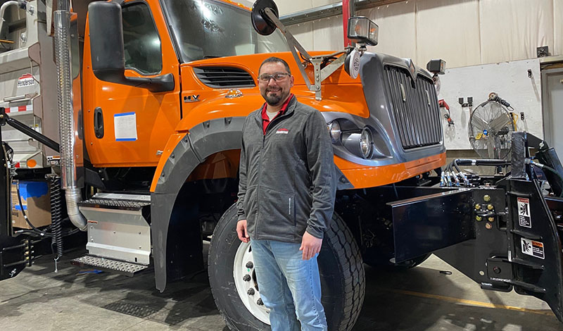 Man in front of a truck