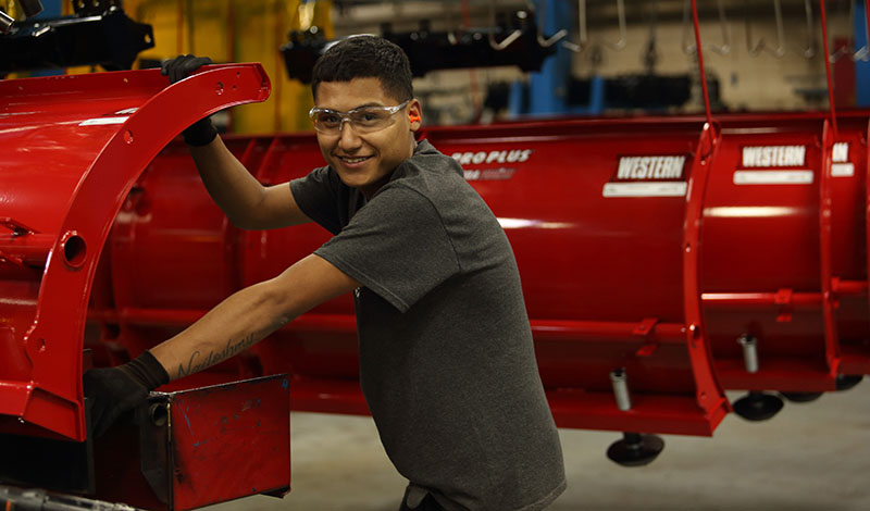 Man working on Western plow